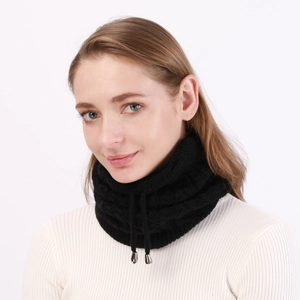 Close-up of black cable knit neck warmer featuring adjustable drawstring with silver tips