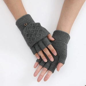 Detailed view of dark grey knitted fingerless gloves with diamond pattern and flip cover