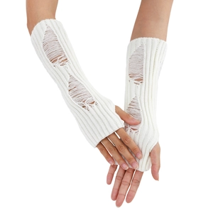 Detailed knit texture of white distressed fingerless gloves in a stylish punk y2k aesthetic