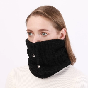 Detail of black cable knit neck warmer featuring adjustable drawstring and soft texture