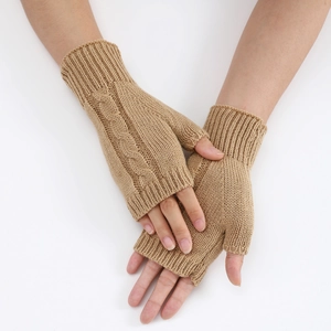 Detail of cable knit fingerless gloves in khaki showing soft wool texture and rib cuffs