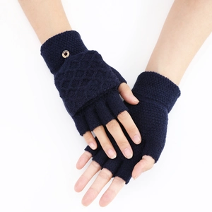Close-up of dark blue knitted gloves with diamond pattern and flip-top cover design