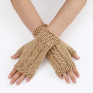 Detail of camel cable knit fingerless gloves with a stylish twisted texture and long cuff