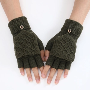 Detail of dark green knitted fingerless gloves with rhombus pattern and fashion button