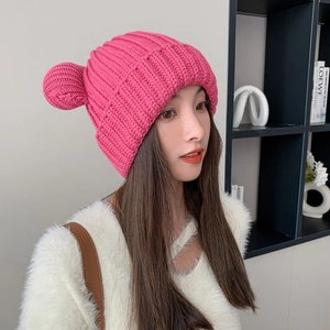 Detailed knit texture of rose pink winter beanie with cute bear ear design and warm finish