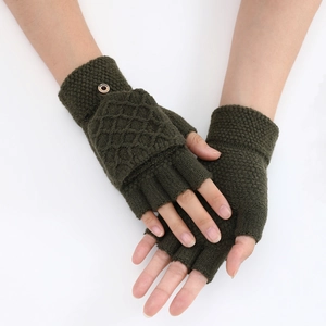 Detail of dark green knitted flip top mittens showing diamond texture and wood button