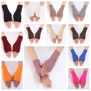 Detail view of colorful ribbed knit fingerless gloves with thumb hole for winter