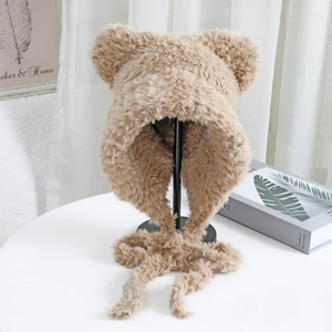 Detail of plush camel cat ear hat showing soft faux fur texture and long braided straps