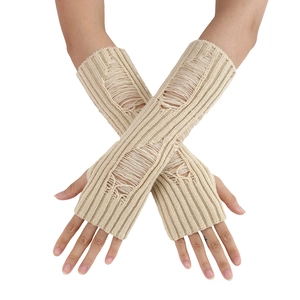 Detail of beige knit arm warmers with distressed hole design and ribbed texture