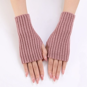 Detailed view of pink ribbed knit fingerless gloves with soft vertical stripe texture