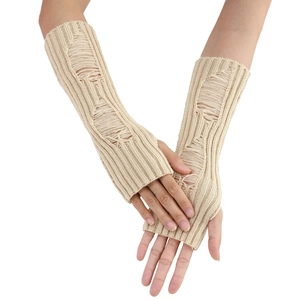 Close-up of beige distressed knit fingerless arm warmers with hole details for women