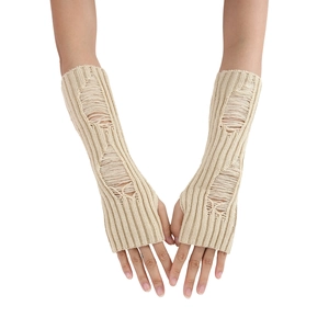 Detail showing distressed ripped knit texture on cream white arm warmers with thumb holes