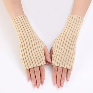 Detail shot of beige ribbed knit arm warmers showing the vertical texture and fingerless design