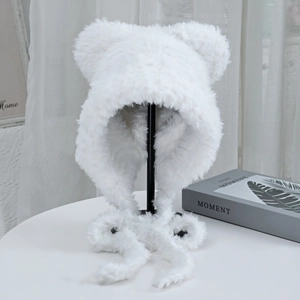Detail shot of white plush balaclava hat with cute bear ears on a minimal display