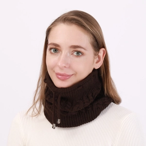 Detail of dark brown knitted neck warmer with thick cable pattern and silver drawstring tips