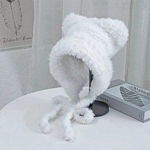 Detailed view of the soft white faux fur cat ear hat with long fluffy plush tassels