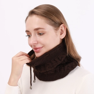 Detail of dark brown cable knit snood featuring fleece lining and silver metal drawstrings