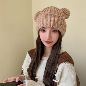 Detailed knit texture of light brown bear ear beanie showing high quality wool blend weave