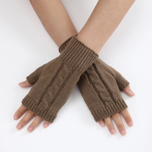 Detail of brown cable-knit fingerless gloves showing soft texture and ribbed cuffs