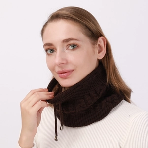 Detailed view of dark coffee knit snood with thick cable pattern and fleece lining