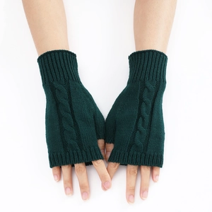 Macro detail of dark green cable knit fingerless gloves with ribbed wrist cuffs