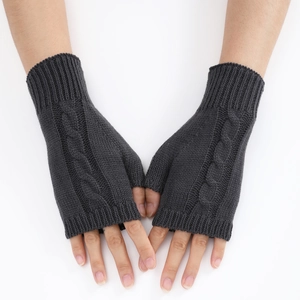 Detailed close-up of dark grey cable knit pattern on fingerless arm warmers