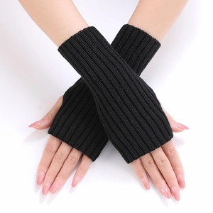 Detail of black ribbed knit arm warmers with thumb hole for winter warmth and flexibility