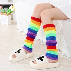 Detail of vibrant rainbow striped knit leg warmers with vertical ribbed texture and elastic fit