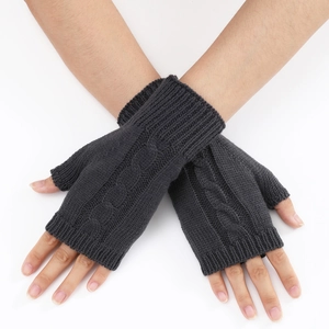 Detail view of dark grey cable knit pattern on fingerless warm winter gloves