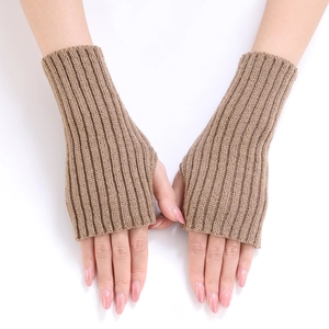 Detail of ribbed knit arm warmers in camel showing texture and fingerless design