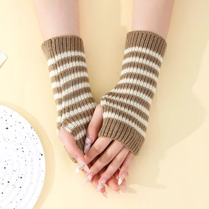 Detail of brown and white striped knit fingerless gloves showing thumb hole and ribbing