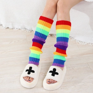 Close-up of rainbow striped knit leg warmers showing soft texture and colorful design