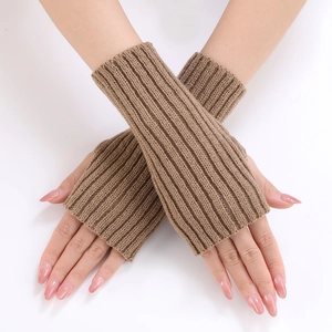 Detailed view of rib-knit texture on brown fingerless gloves showing premium craftsmanship