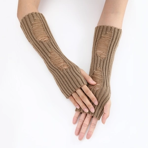 Detail of distressed knit texture on long fingerless gloves with thumb hole