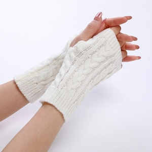Detailed cable knit texture of white fingerless arm warmers for women's winter fashion
