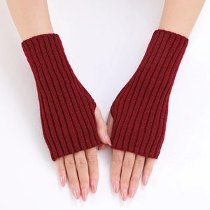 Detailed texture of dark red ribbed knit fingerless gloves with thumb hole for women