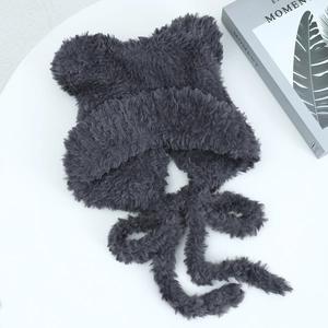 Detailed close-up of dark grey plush cat ear winter hat with soft faux fur texture