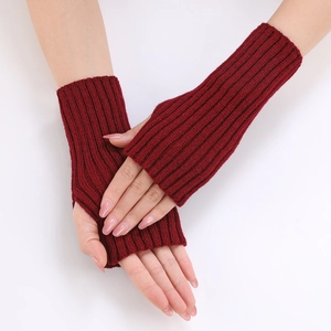 Detail view of burgundy ribbed knit fingerless gloves with thumb hole for women
