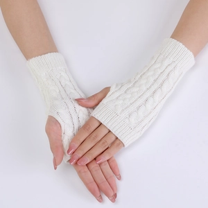 Detailed view of white cable knit arm warmers featuring fingerless design and ribbed cuffs