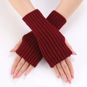 Close-up of burgundy ribbed knit fingerless gloves with thumb hole for winter warmth