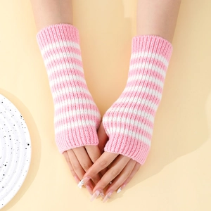 Detail of pink and white striped knit fingerless gloves showing soft yarn texture