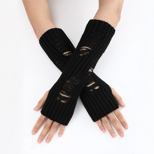 Close-up of black distressed knit fingerless gloves with ribbed texture and holes