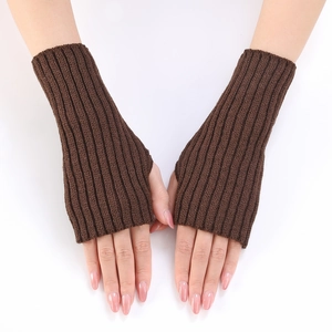 Close-up of brown ribbed knit arm warmers showing thumb hole and chunky texture