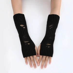 Close-up of black punk knit arm warmers featuring irregular distressed hole details