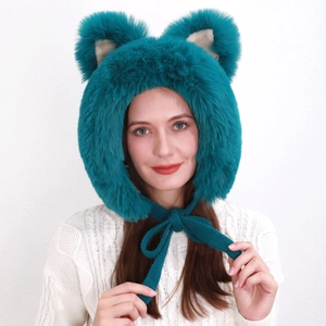 Close-up of fuzzy teal faux fur hat with bear ears and thick knit drawstring ties