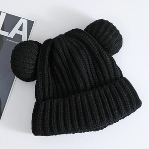 Detailed close-up of black ribbed knit beanie featuring cute animal ears and thick texture