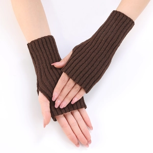 Detailed view of dark brown ribbed knit fingerless gloves with functional thumb hole
