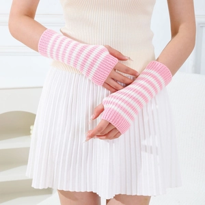 Detail of pink and white striped knit fingerless gloves with soft ribbed texture