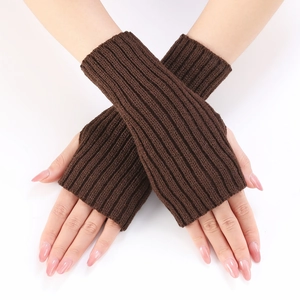 Close-up of brown chunky ribbed knit fingerless gloves showing detailed arm sleeve texture