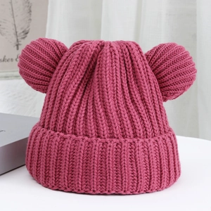Detailed texture of thick ribbed knit rose red beanie with cute bear ears for winter